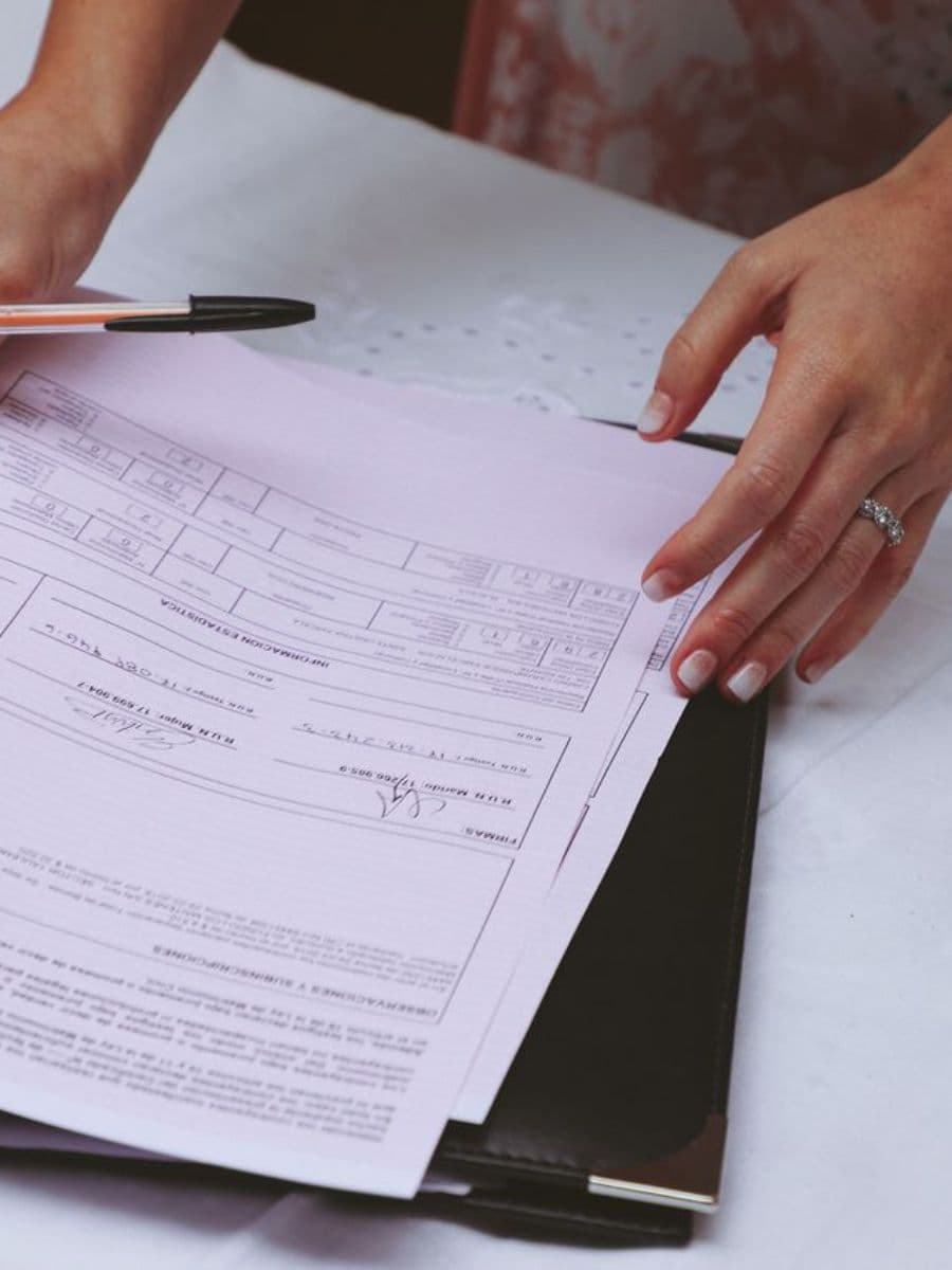 Digital nomad visa file with documents, a passport and a laptop